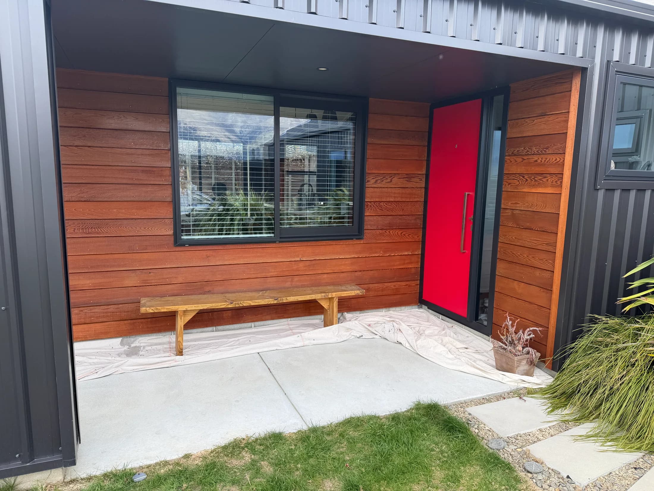 Freshly oiled cedar at the sheltered entrance in Wānaka
