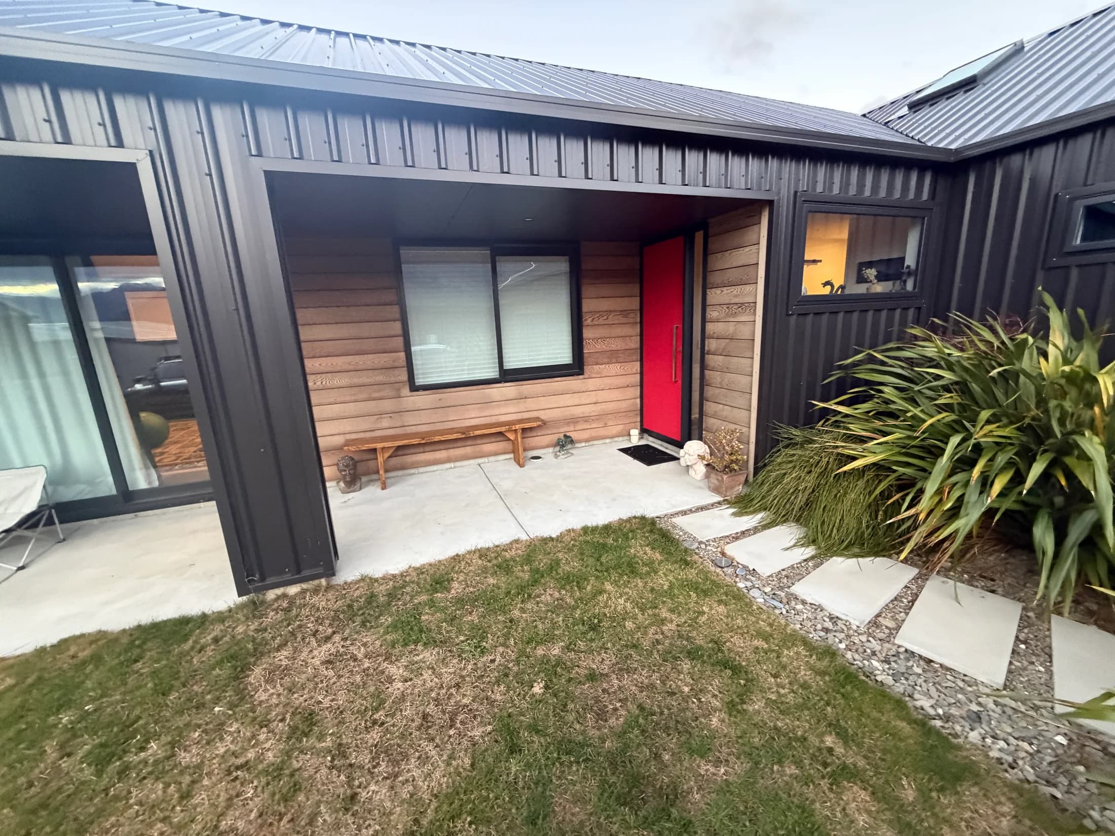 Cedar at the sheltered entrance before cleaning in Wānaka