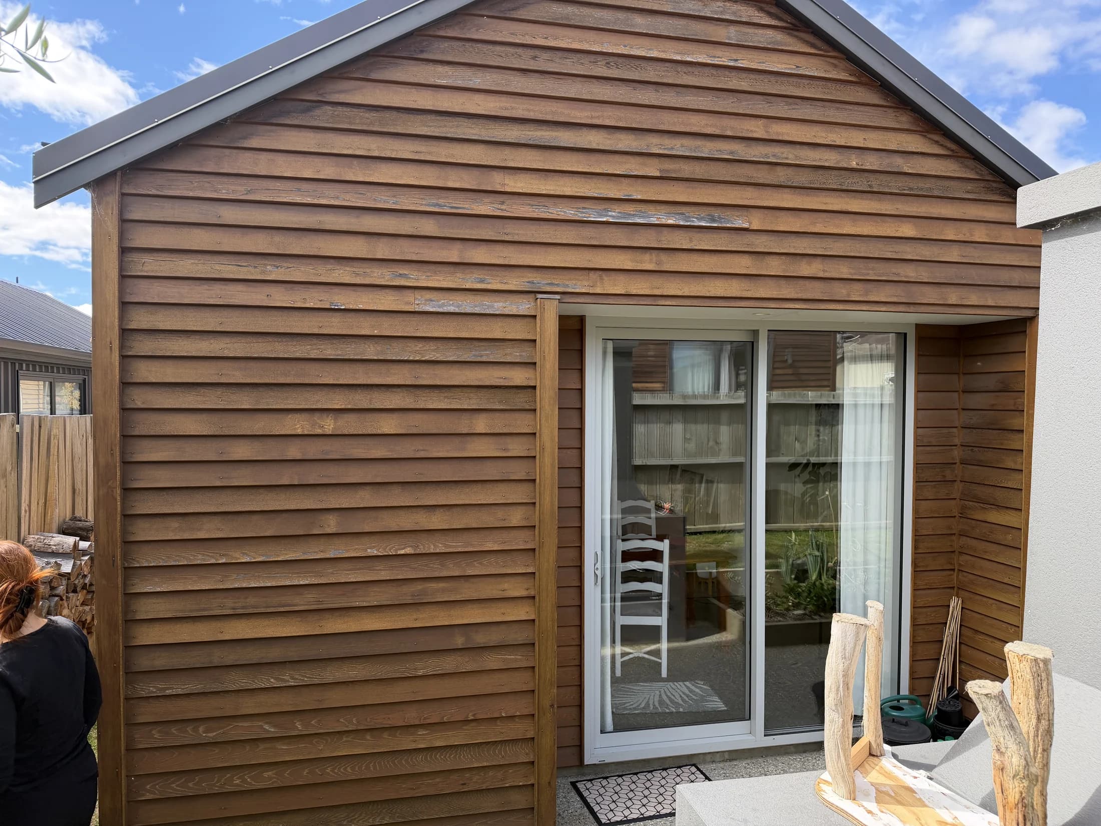Cedar weatherboards with failed stain before restoration, Northlake Wanaka