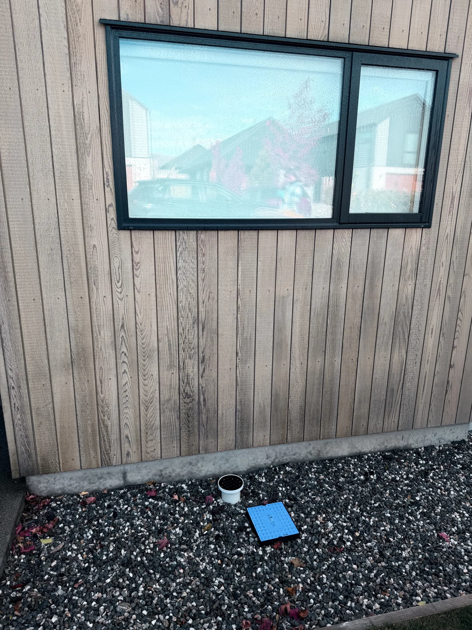 Dry greying cedar cladding before oil stain in Northlake, Wanaka