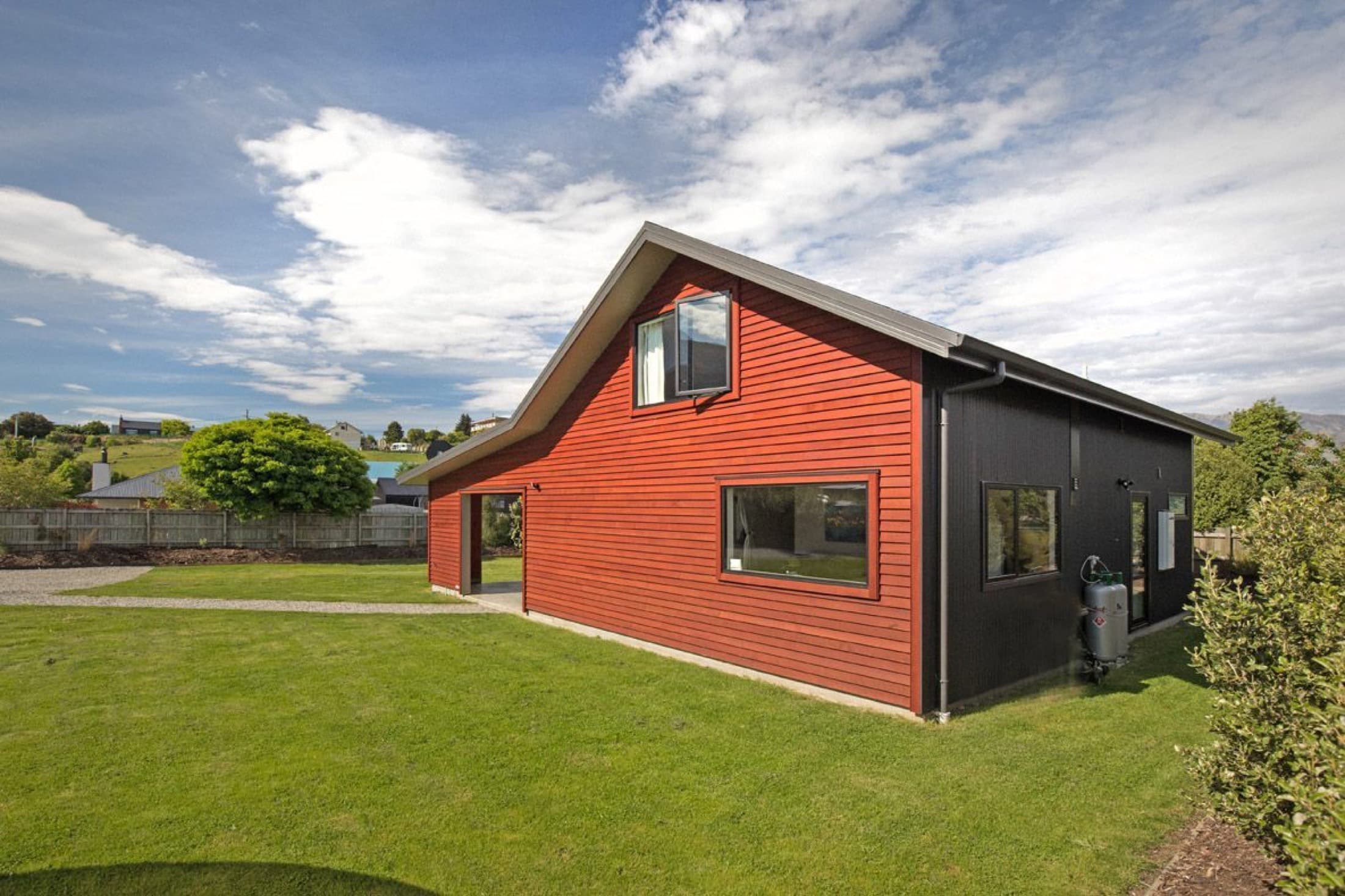 Weathered cedar cladding before restaining in Lake Hawea