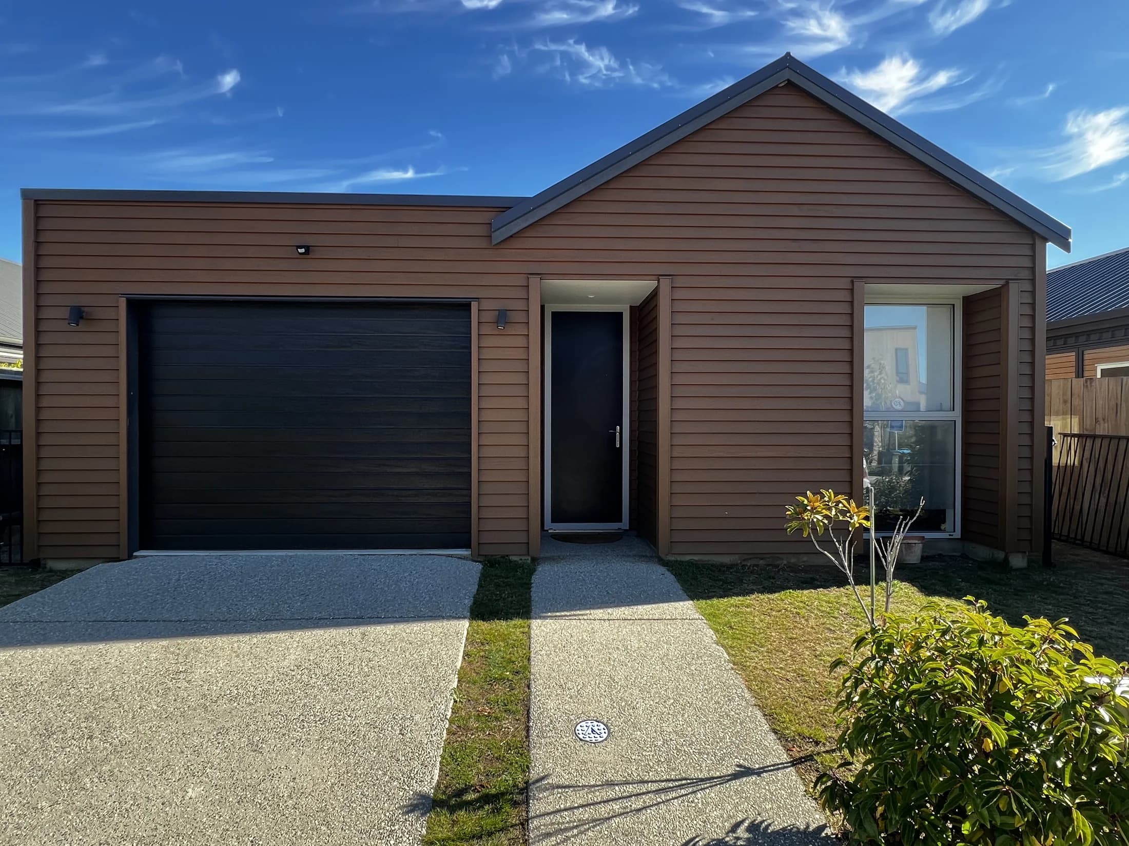 Restained cedar cladding front elevation after restoration, Northlake Wanaka